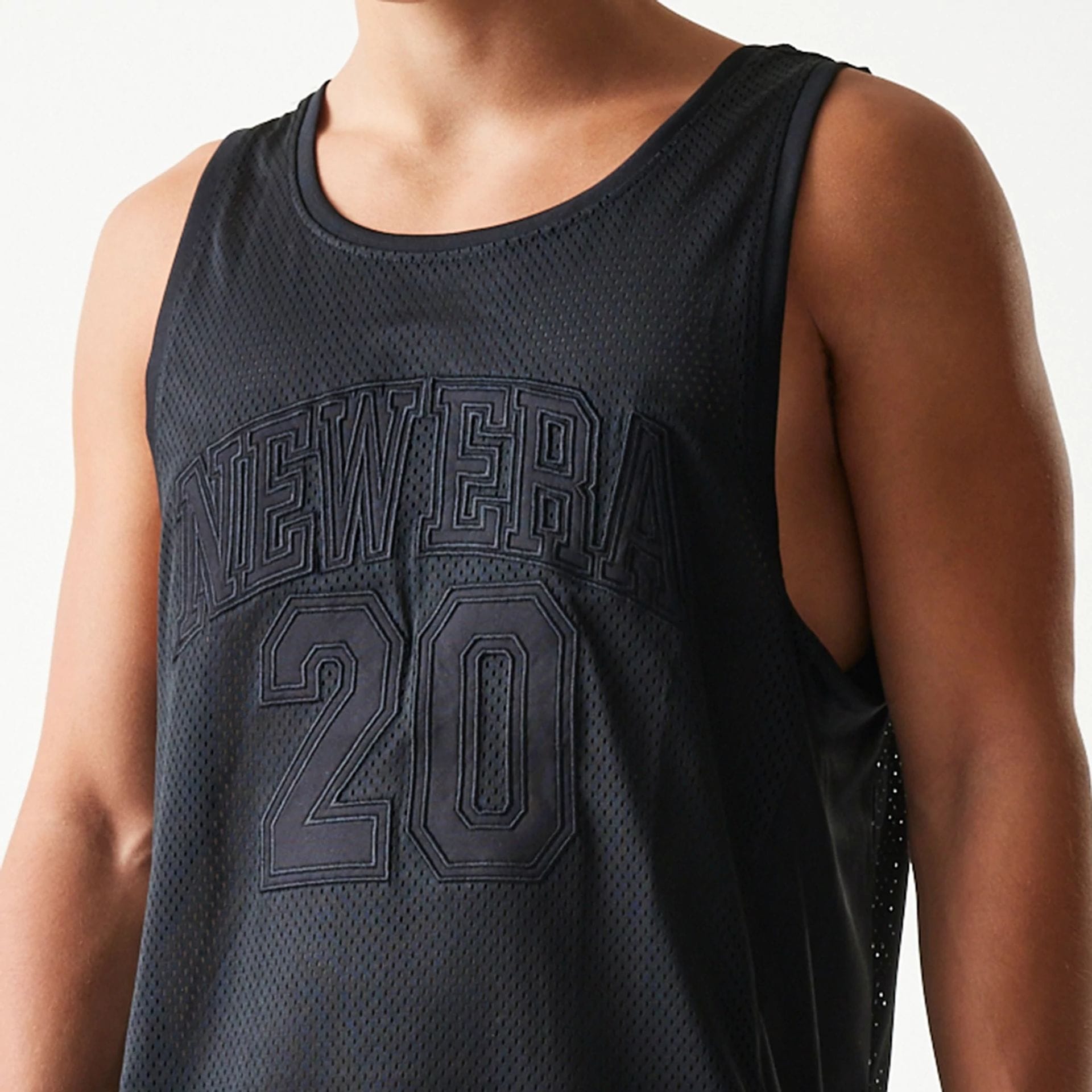 The Male model is wearing New Era Mesh Black Mesh Vest 4