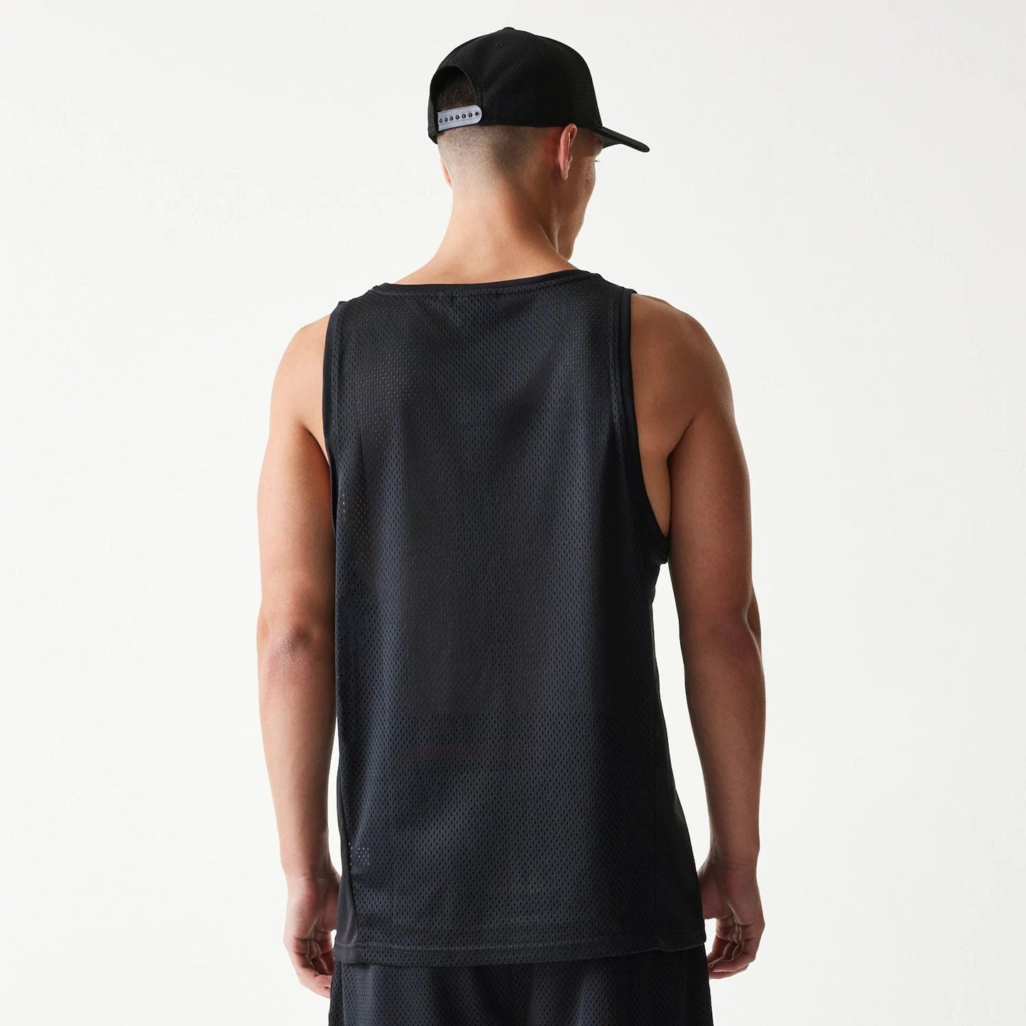 The Male model is wearing New Era Mesh Black Mesh Vest 2