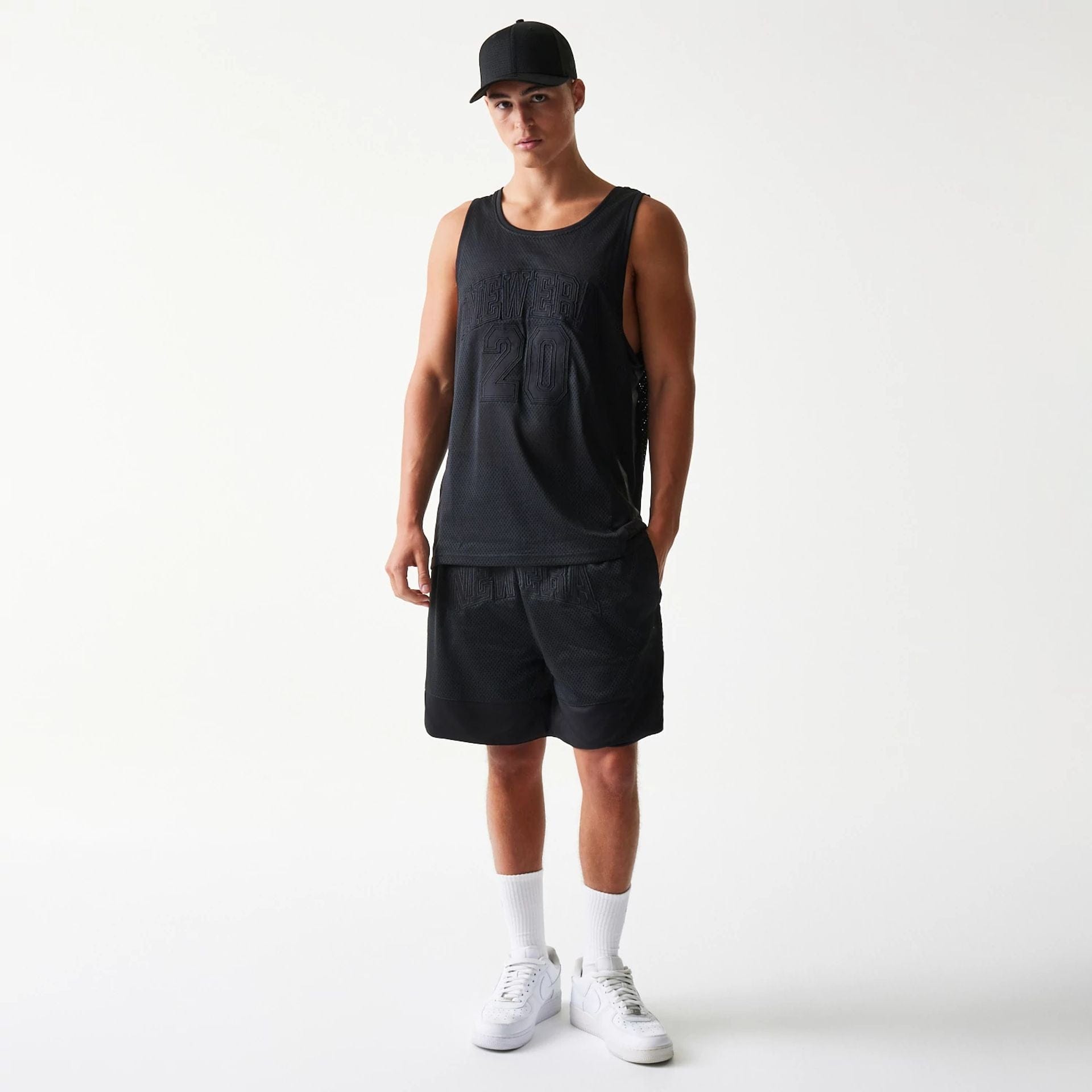 The Male model is wearing New Era Mesh Black Mesh Vest 6