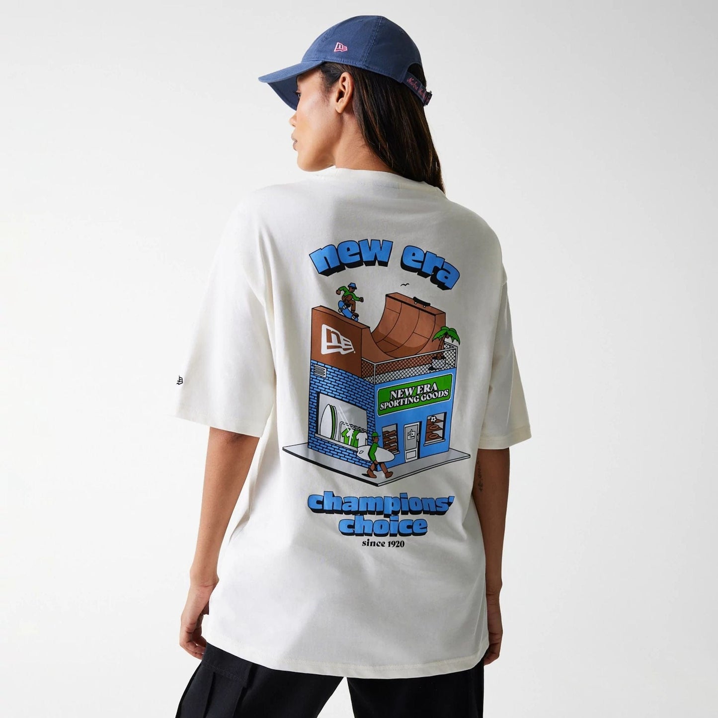 The Male model is wearing New Era Skate Graphic Open White Oversized T-Shirt 2