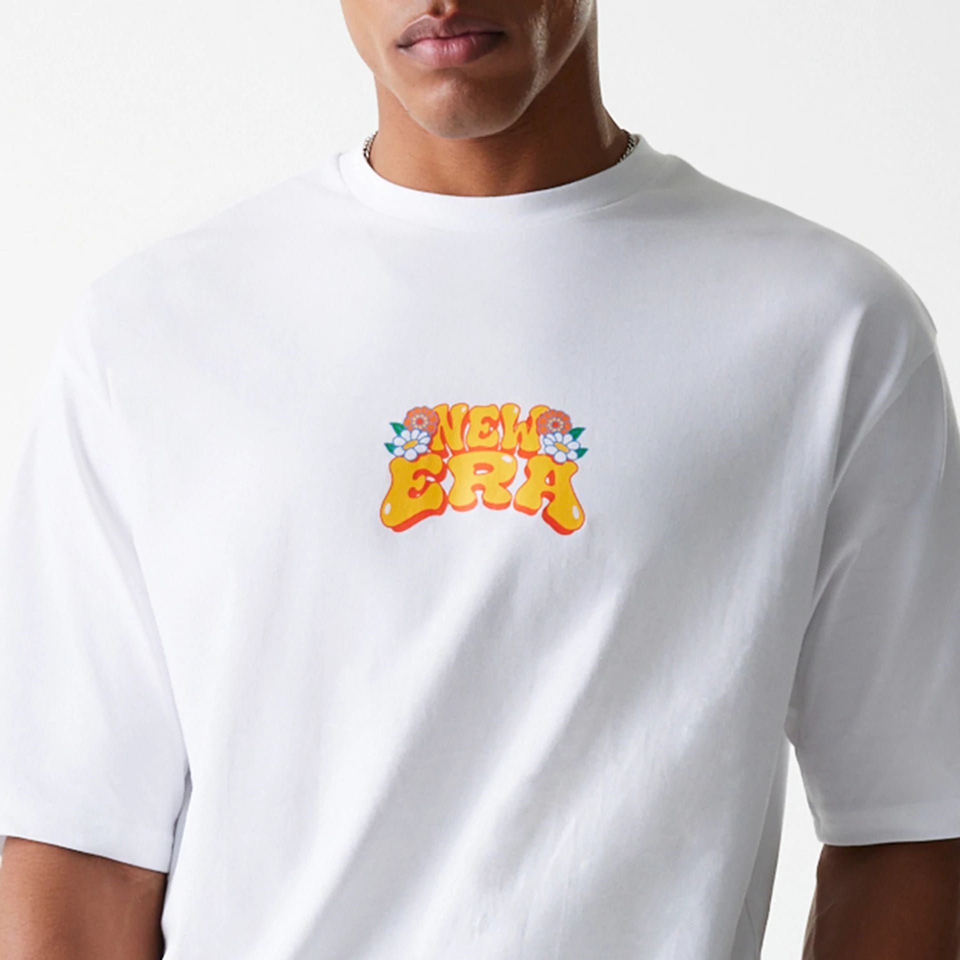 The Male model is wearing New Era Graphic White Oversized T-Shirt 5