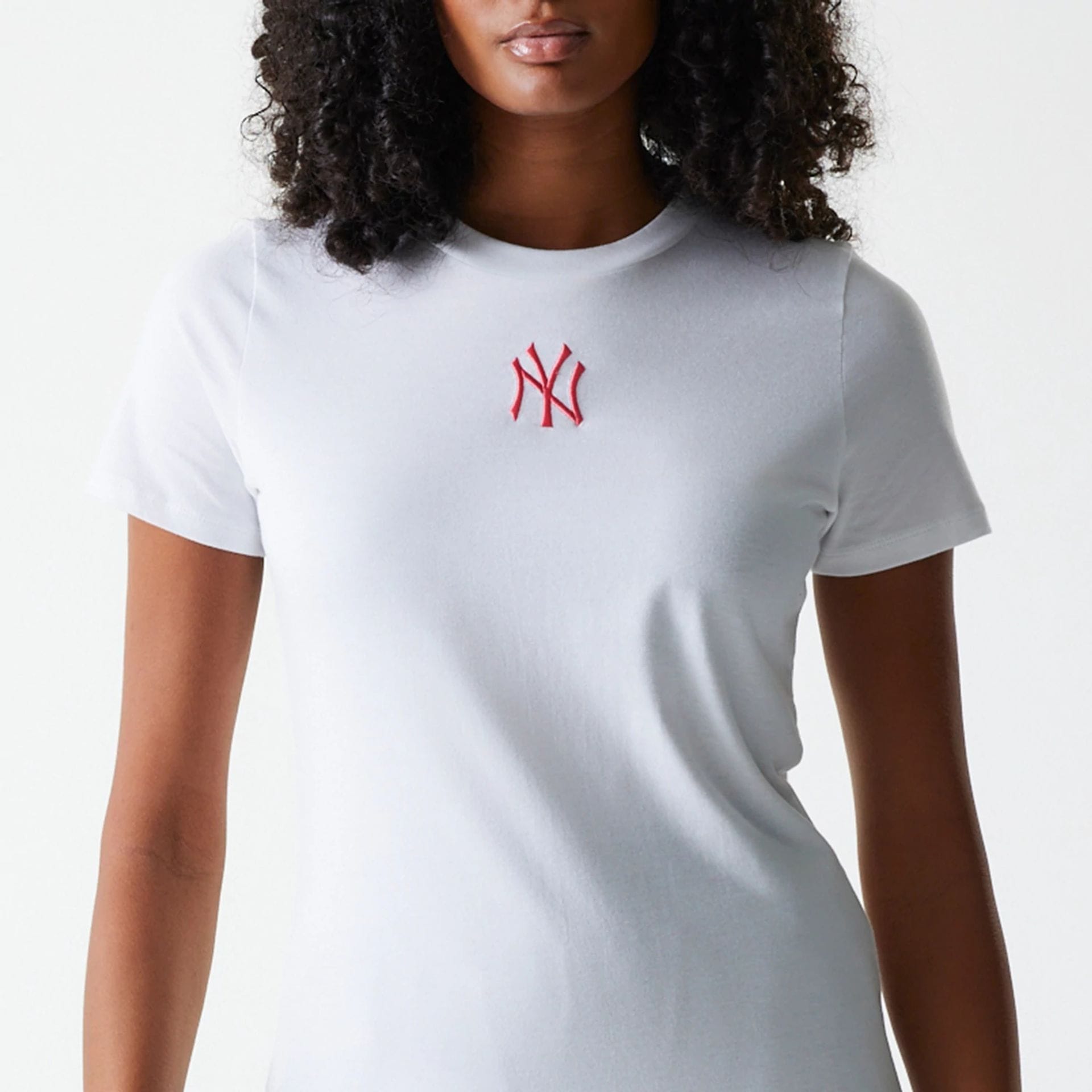 The Female model is wearing New York Yankees Womens MLB Midi League Essential White T-Shirt 3