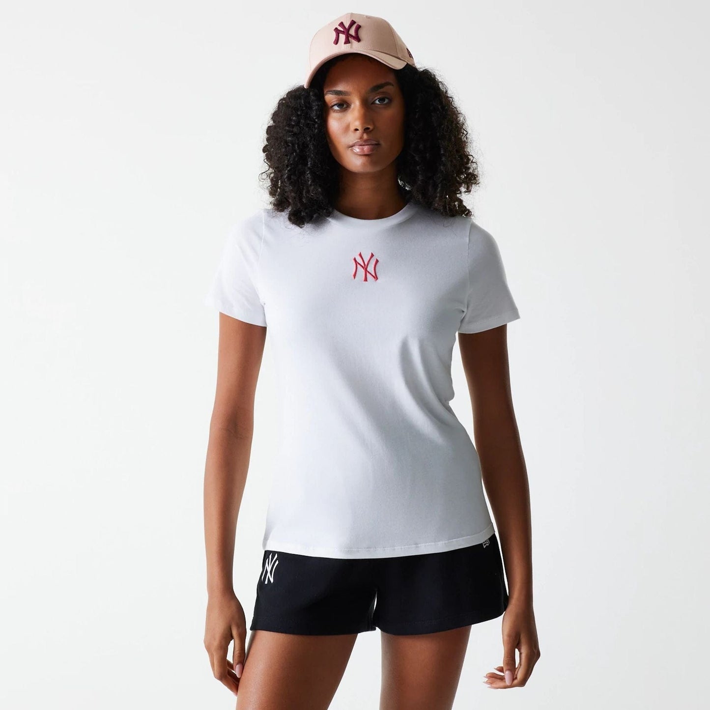 The Female model is wearing New York Yankees Womens MLB Midi League Essential White T-Shirt 1