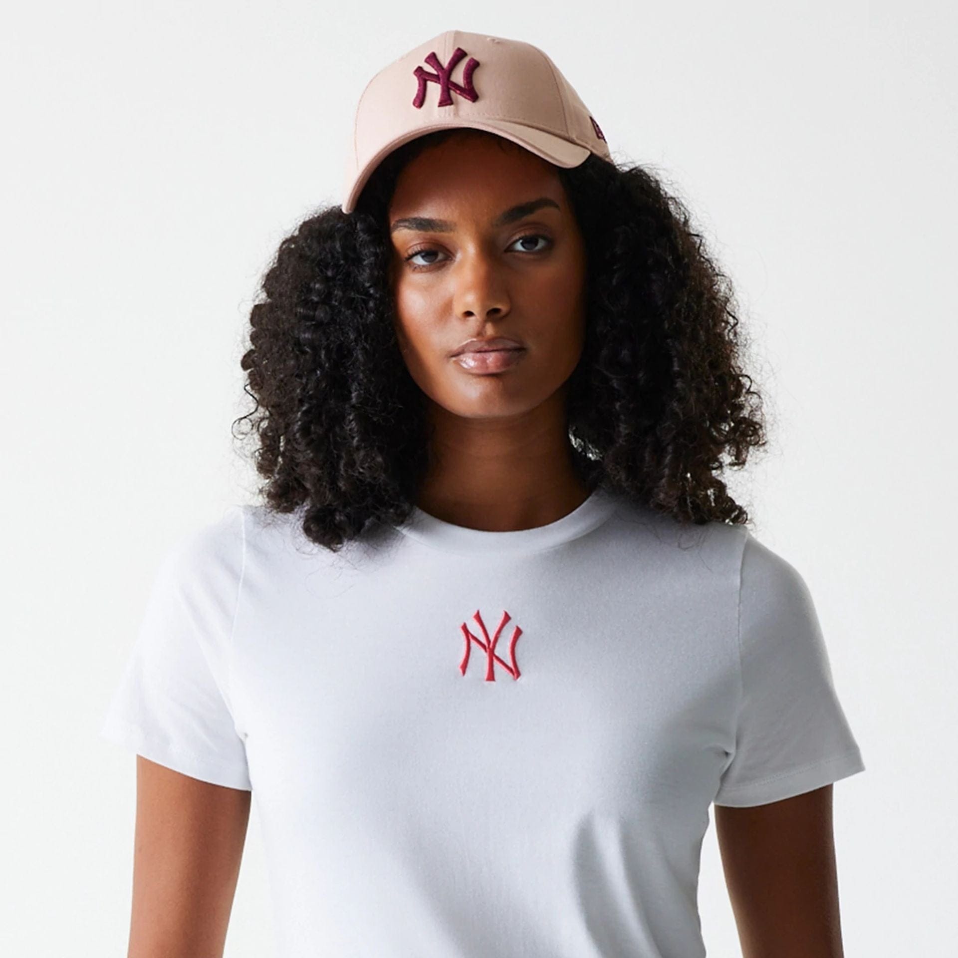 The Female model is wearing New York Yankees Womens MLB Midi League Essential White T-Shirt 6