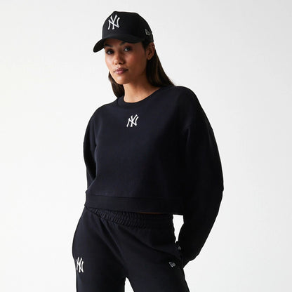 The Female model is wearing New York Yankees Womens MLB Midi League Essential Black Cropped Crew Neck Sweater 7