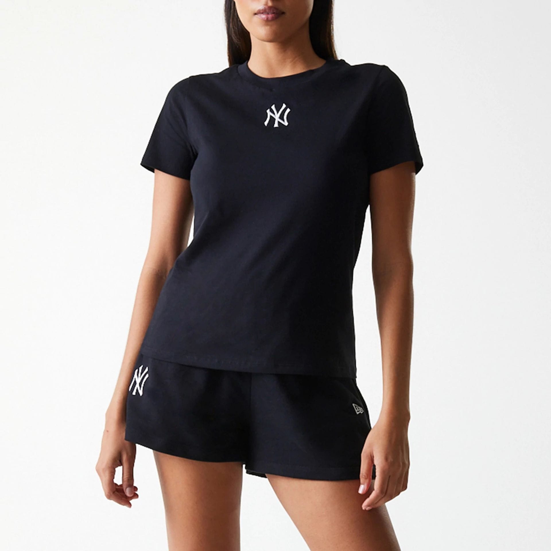 The Female model is wearing New York Yankees Womens MLB Midi League Essential Black T-Shirt 3