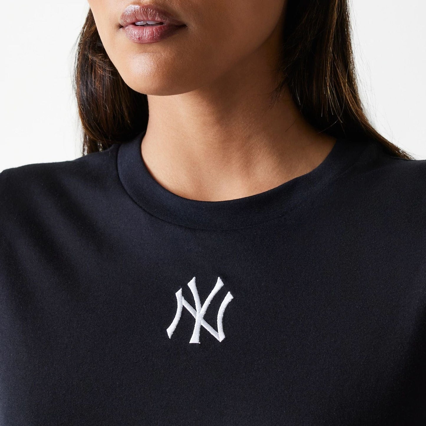The Female model is wearing New York Yankees Womens MLB Midi League Essential Black T-Shirt 4