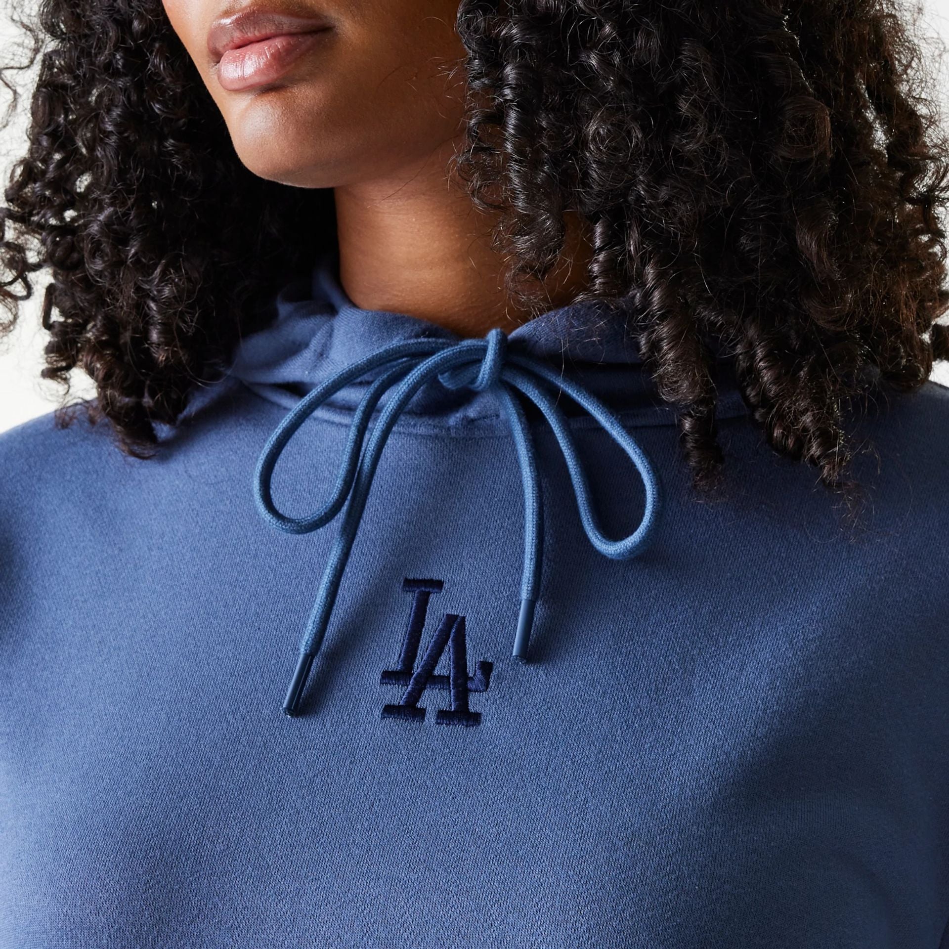 The Female model is wearing LA Dodgers Womens MLB Midi League Essential Dark Blue Pullover Hoodie 4