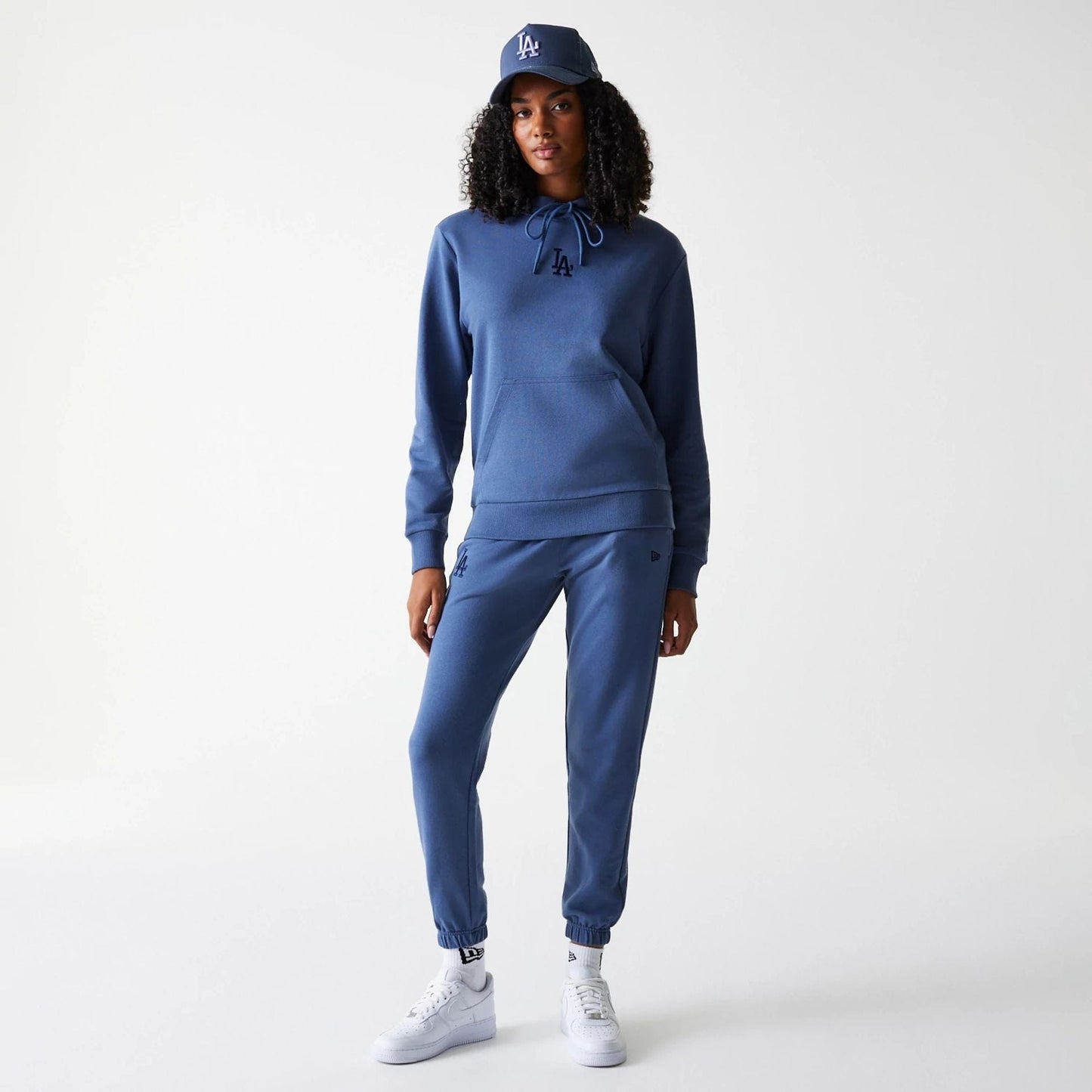 The Female model is wearing LA Dodgers Womens MLB Midi League Essential Dark Blue Pullover Hoodie 8