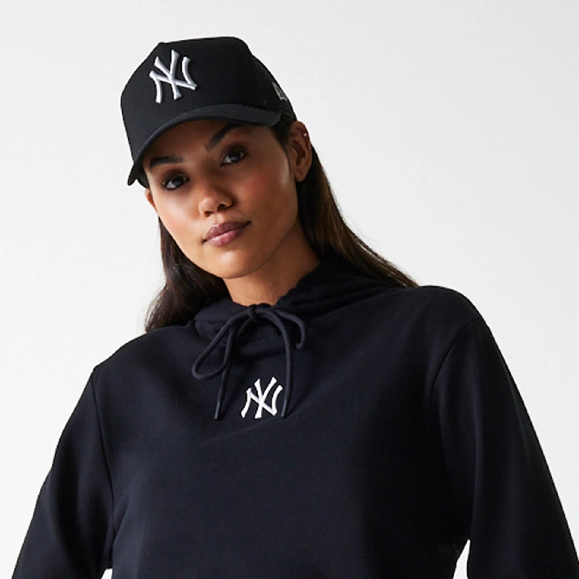 The Female model is wearing New York Yankees Womens MLB Midi League Essential Black Pullover Hoodie 5