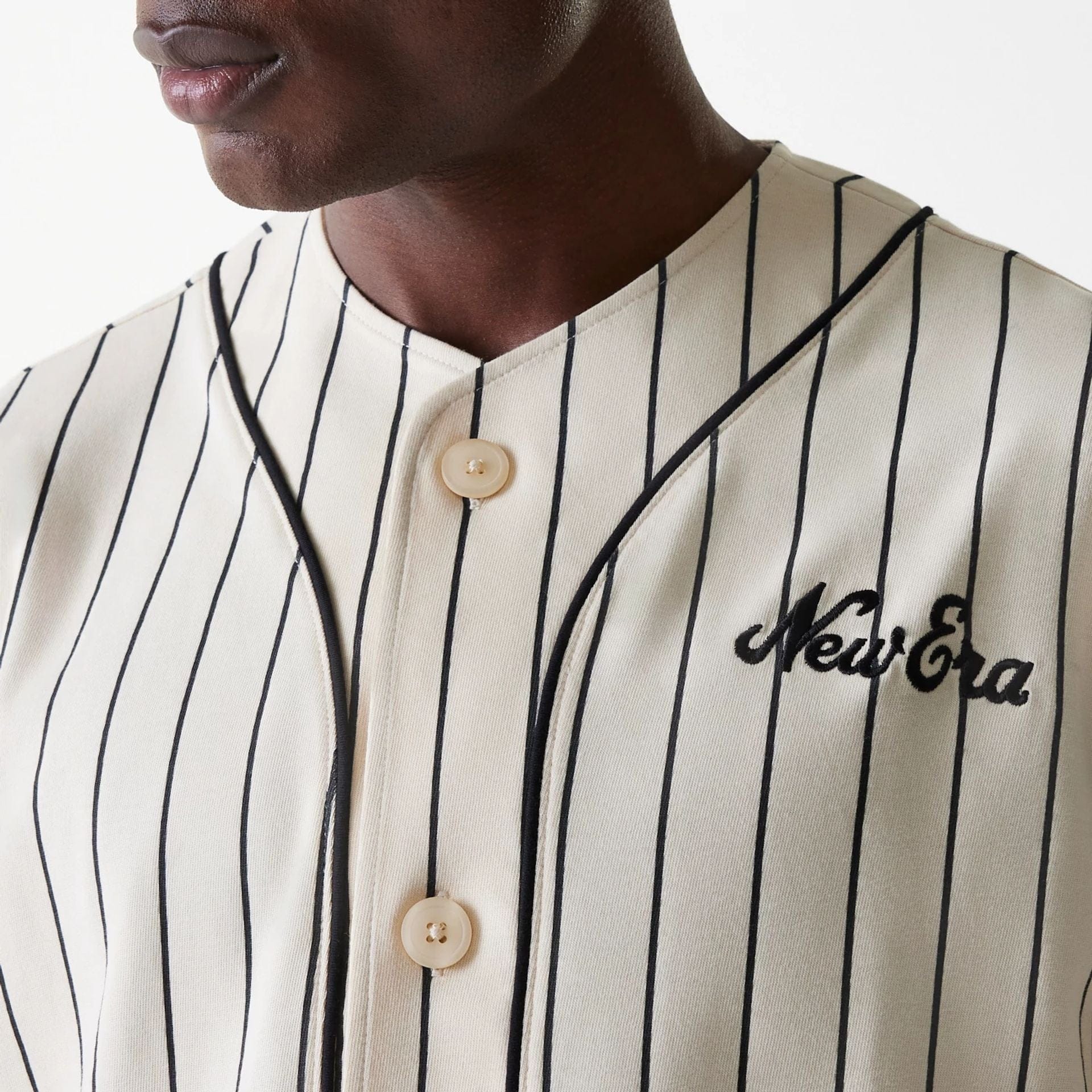 The Male model is wearing New Era Pinstripe Light Beige Jersey 4