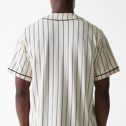 The Male model is wearing New Era Pinstripe Light Beige Jersey 7