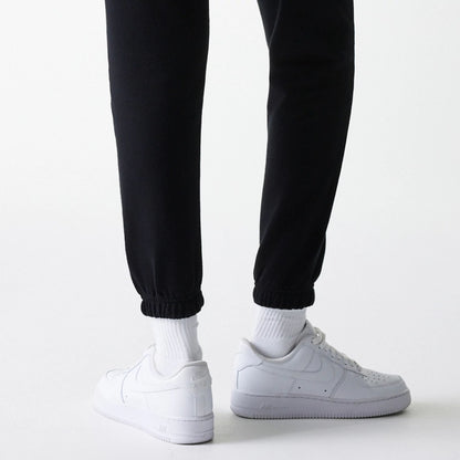 The Female model is wearing New York Yankees Womens MLB Midi League Essential Black Joggers 6