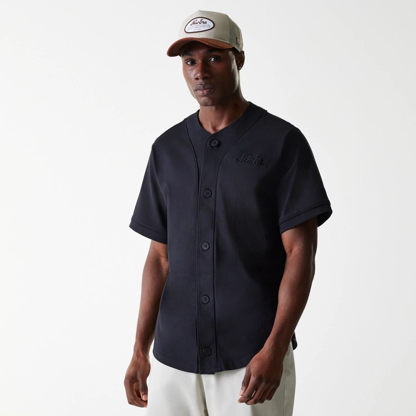 The Male model is wearing New Era Pinstripe Black Jersey 1
