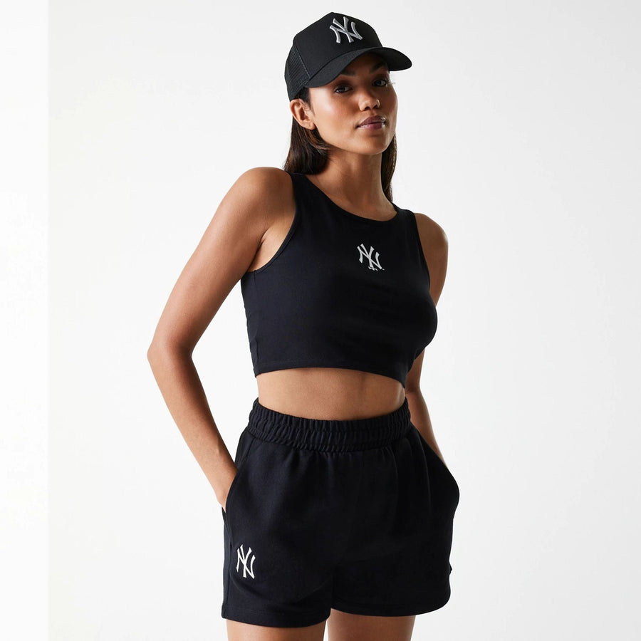 The Female model is wearing New York Yankees Womens MLB Midi League Essential Black Shorts 1