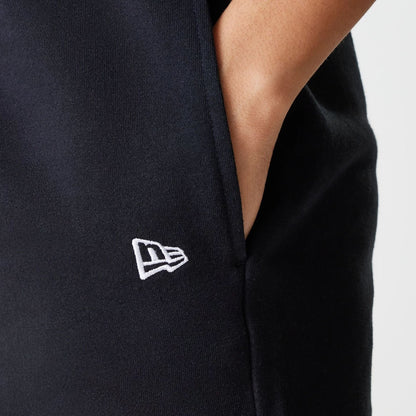 The Female model is wearing New York Yankees Womens MLB Midi League Essential Black Shorts 4