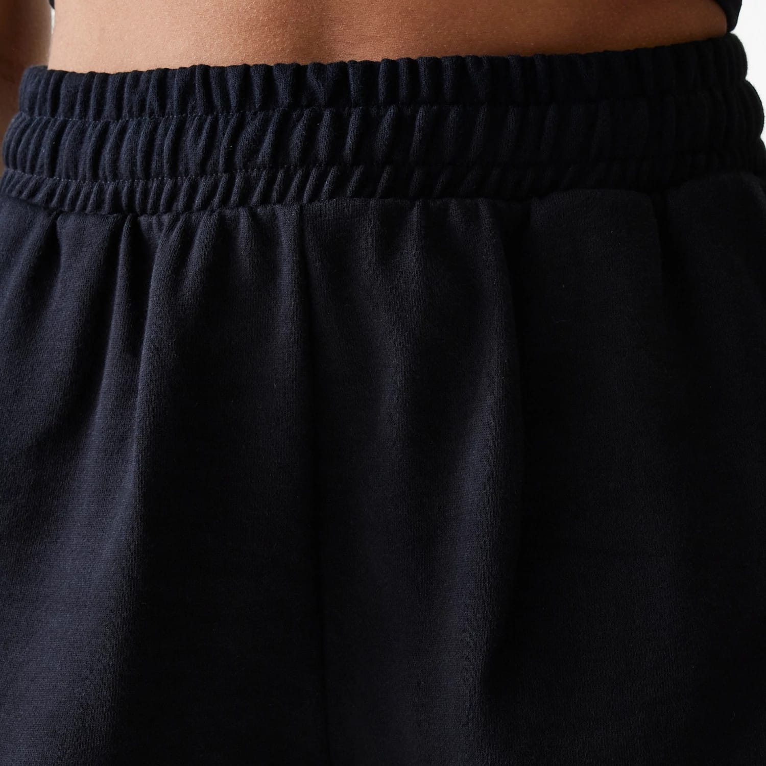 The Female model is wearing New York Yankees Womens MLB Midi League Essential Black Shorts 5