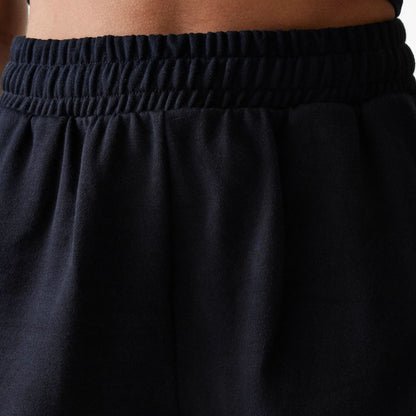 The Female model is wearing New York Yankees Womens MLB Midi League Essential Black Shorts 5