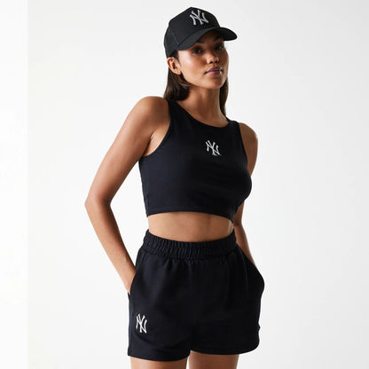 The Female model is wearing New York Yankees Womens MLB Midi League Essential Black Shorts 1