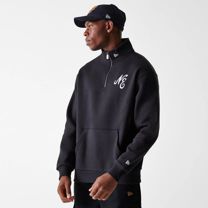 The Male model is wearing New Era Lifestyle Black 1/4 Zip Sweater 3