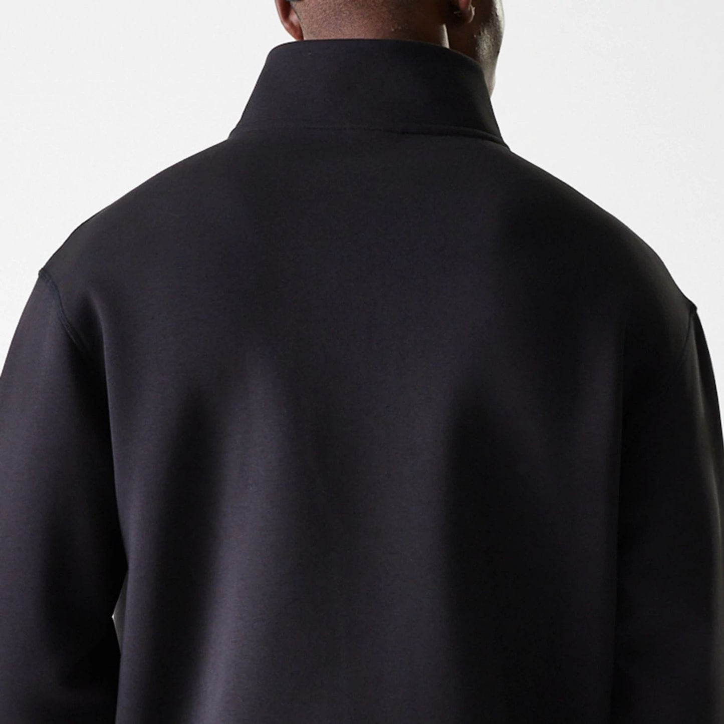 The Male model is wearing New Era Lifestyle Black 1/4 Zip Sweater 8