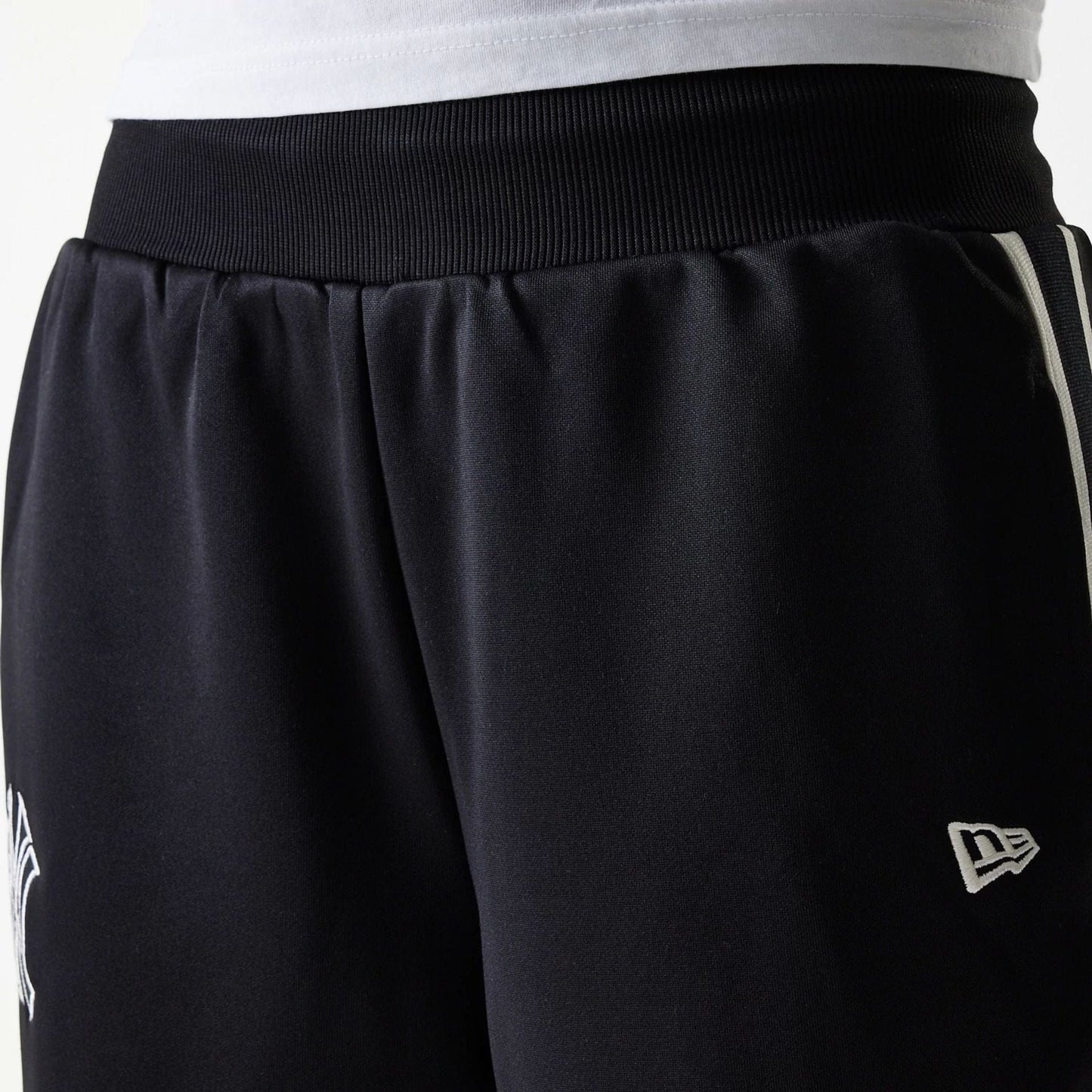 The Female model is wearing New York Yankees Womens MLB Midi Logo Black Track Pants 5