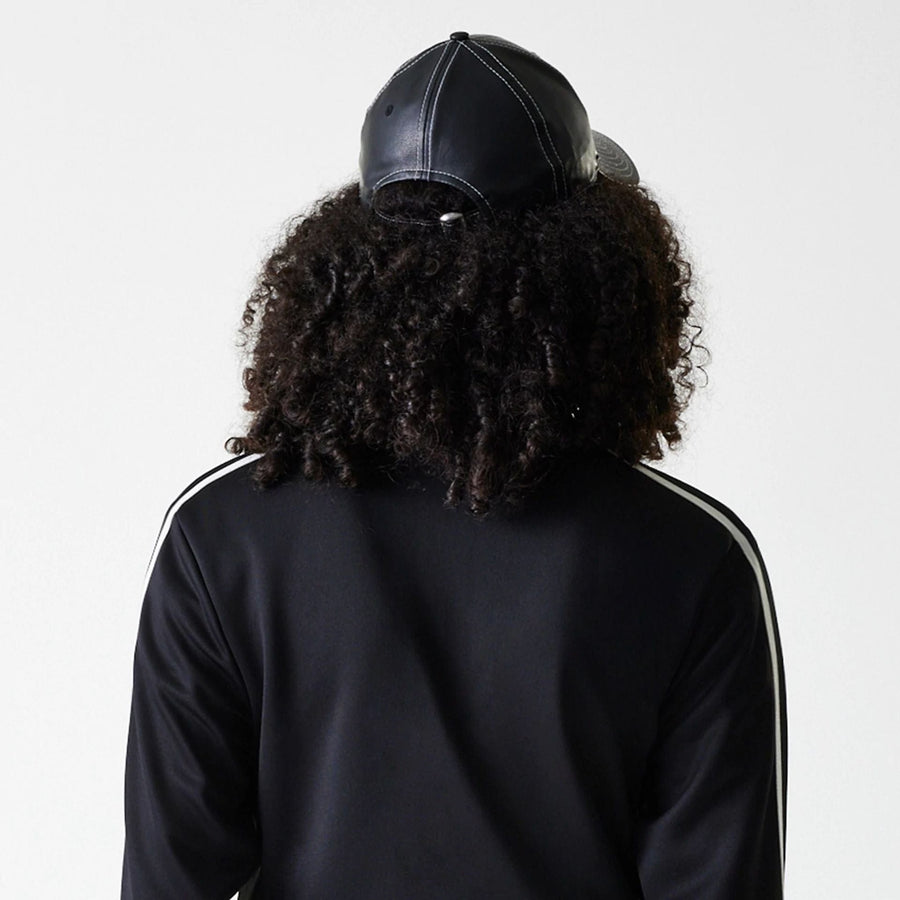 The Female model is wearing New York Yankees Womens MLB Midi Logo Black Track Jacket 6