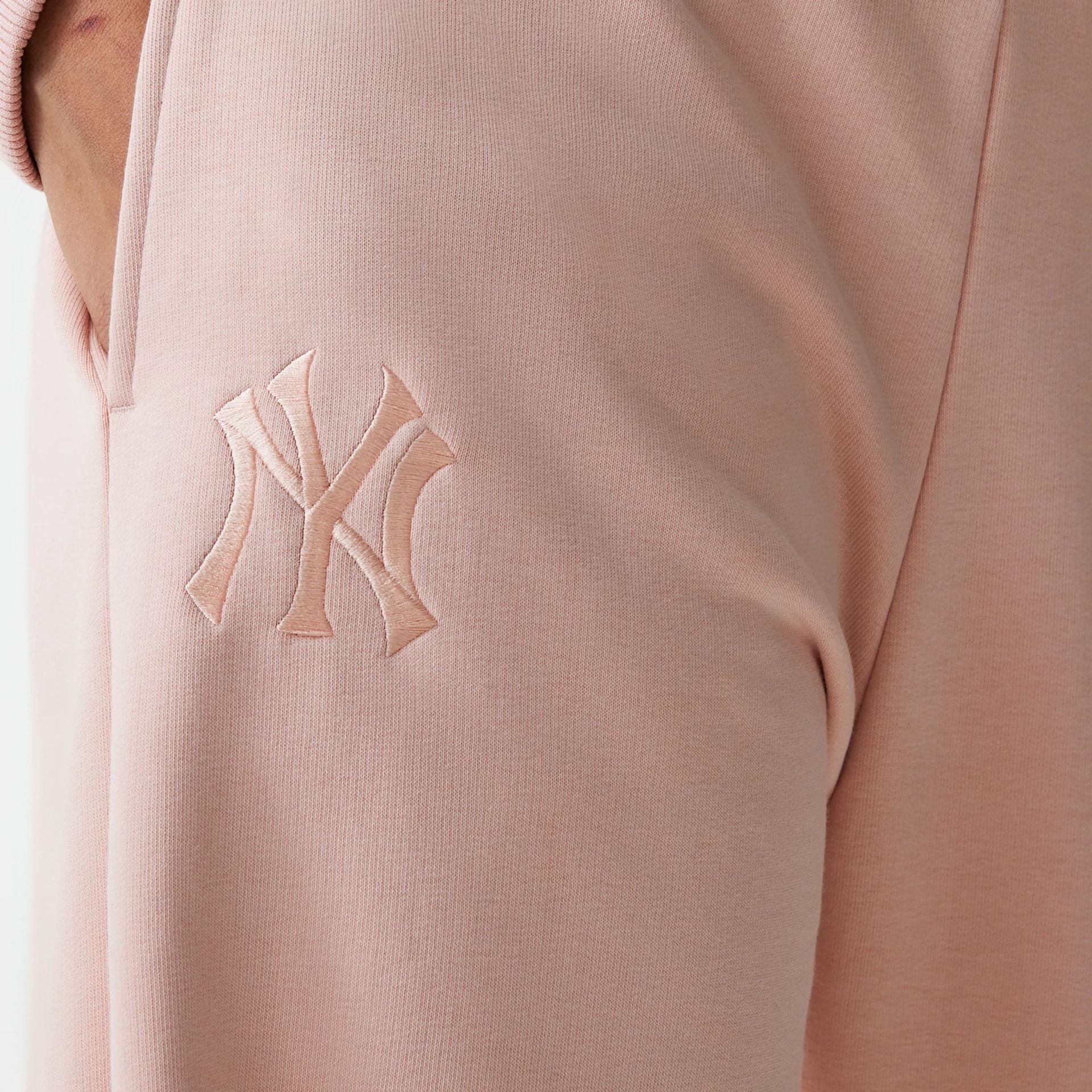 The Female model is wearing New York Yankees Womens MLB Tonal Pastel Pink Straight Leg Joggers 6