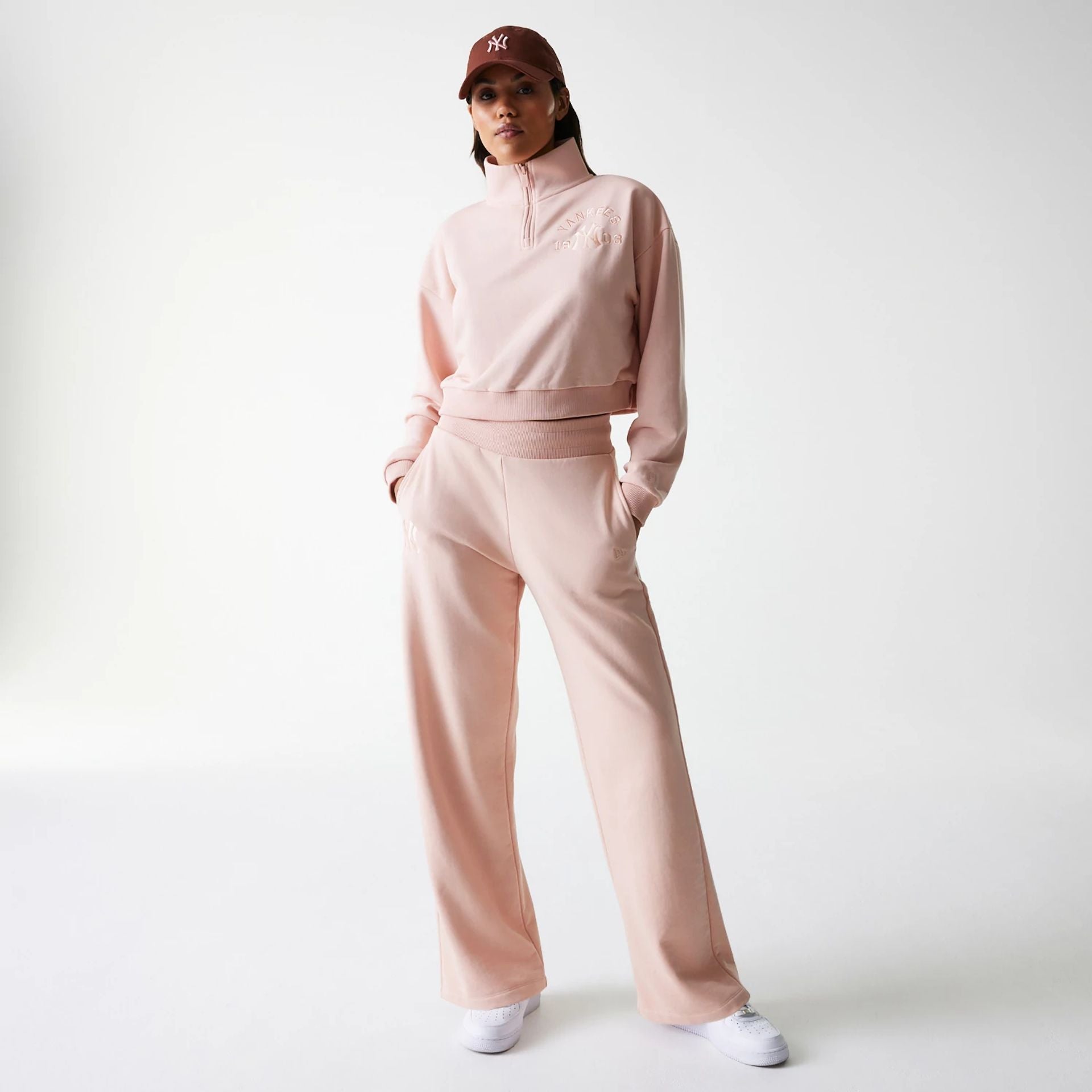 The Female model is wearing New York Yankees Womens MLB Tonal Pastel Pink Straight Leg Joggers 8