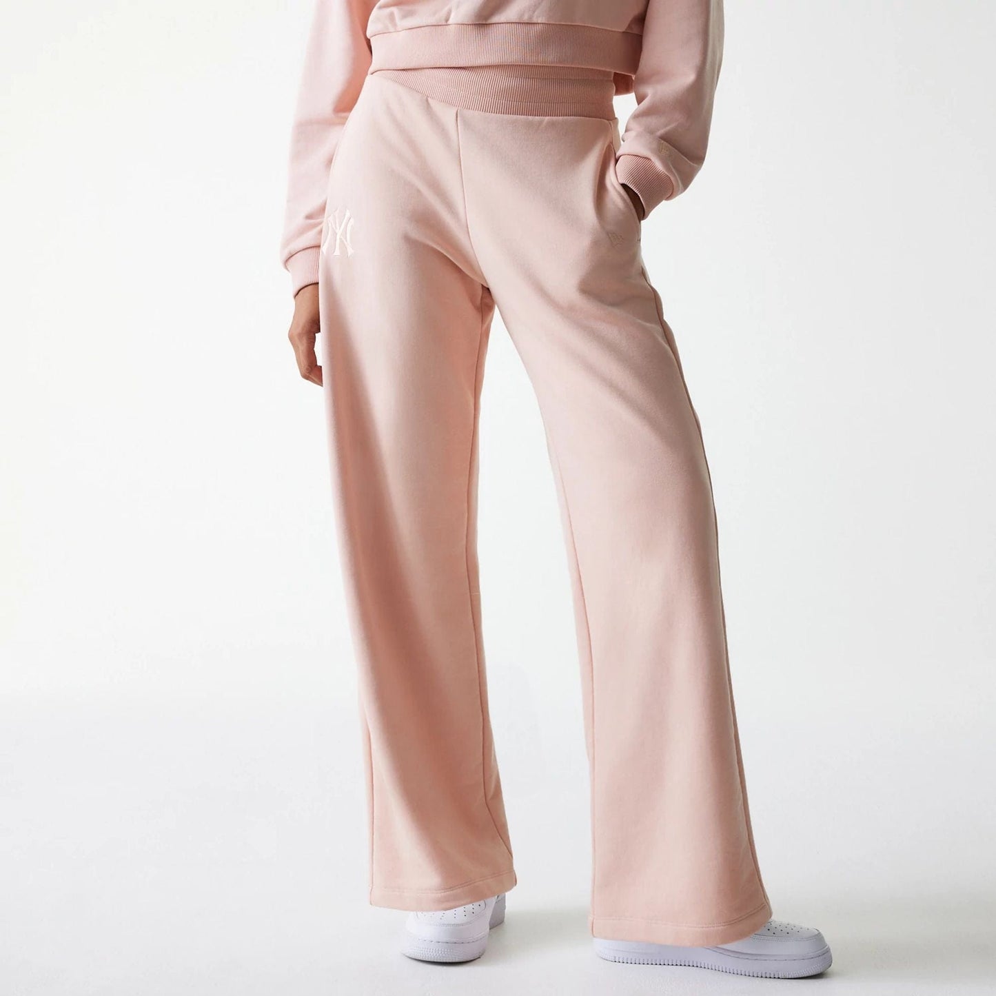 The Female model is wearing New York Yankees Womens MLB Tonal Pastel Pink Straight Leg Joggers 1