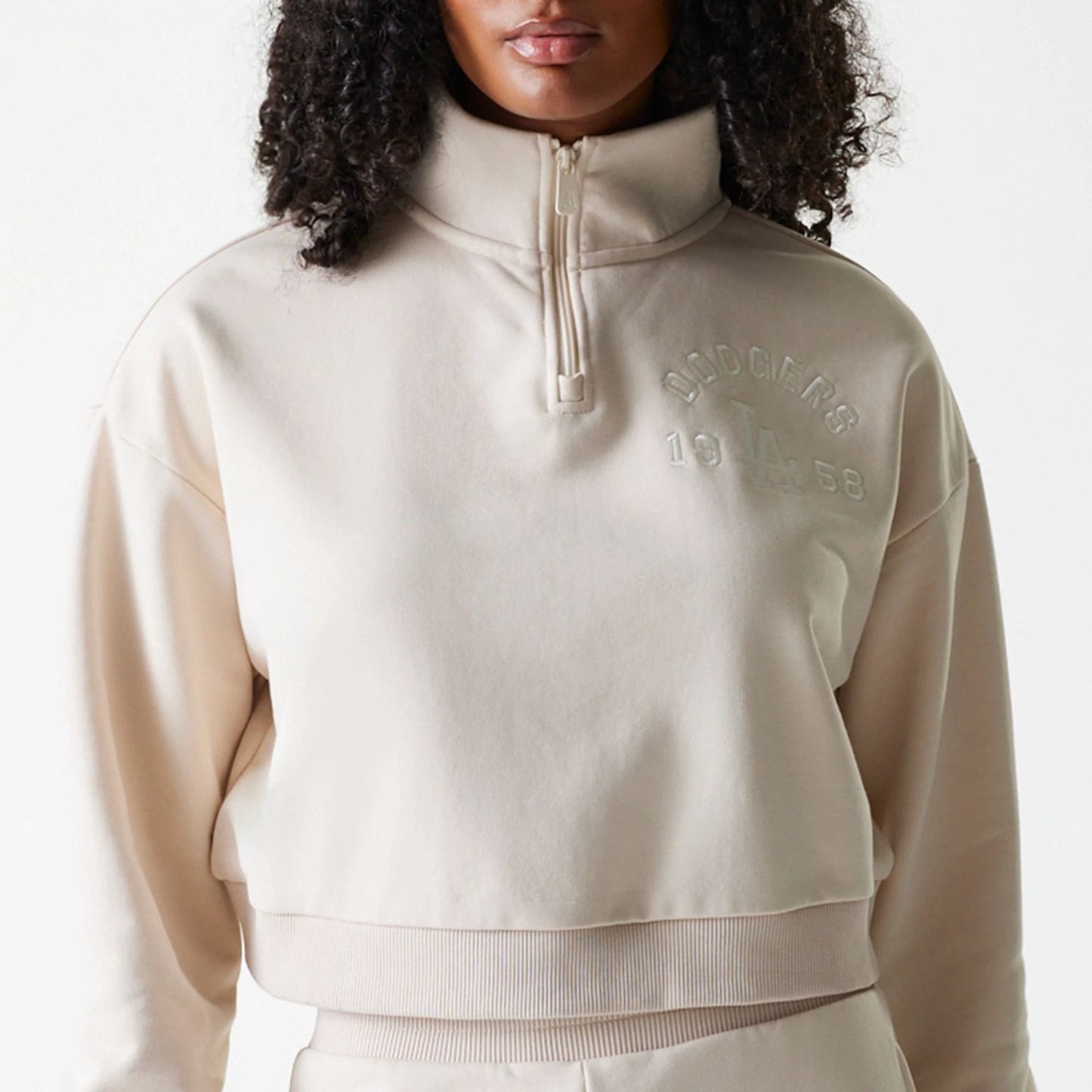 The Female model is wearing LA Dodgers Womens MLB Tonal Light Beige Cropped 1/4 Zip Sweater 3