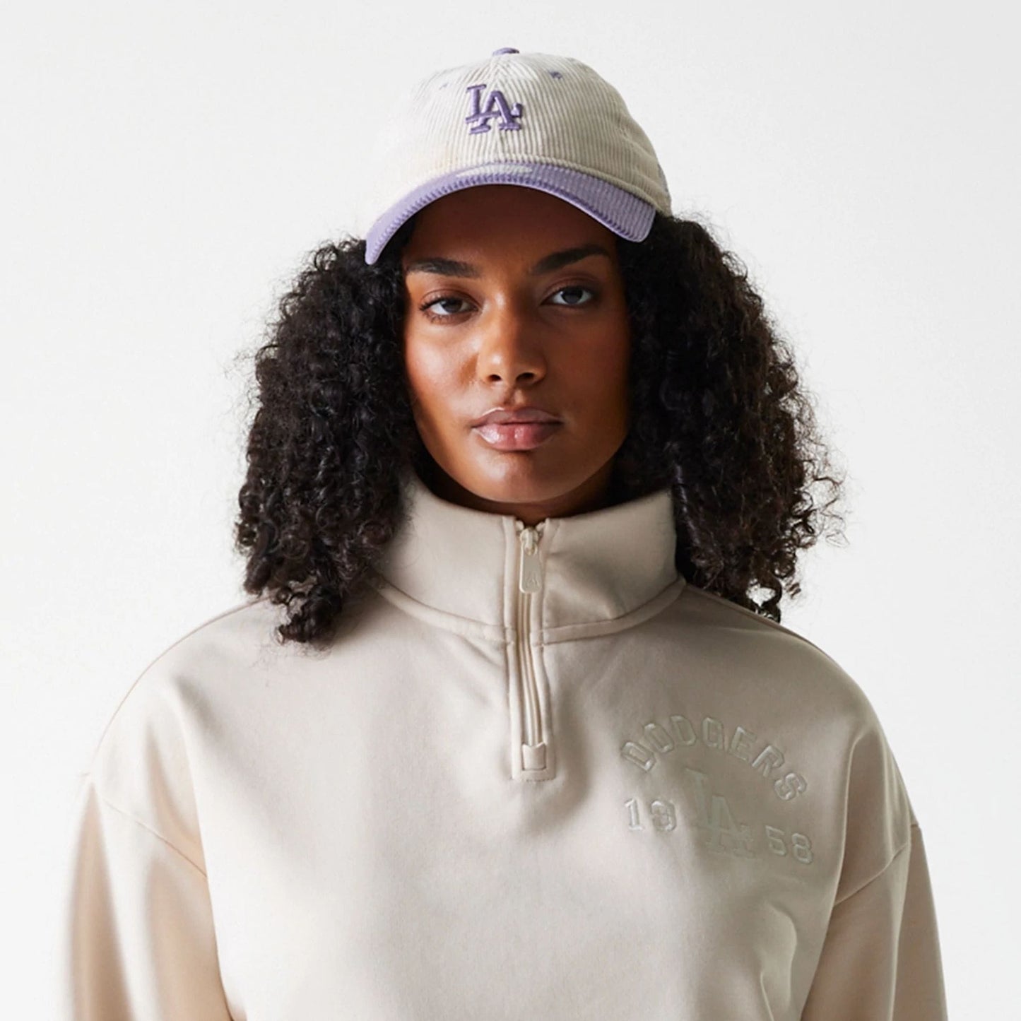 The Female model is wearing LA Dodgers Womens MLB Tonal Light Beige Cropped 1/4 Zip Sweater 6