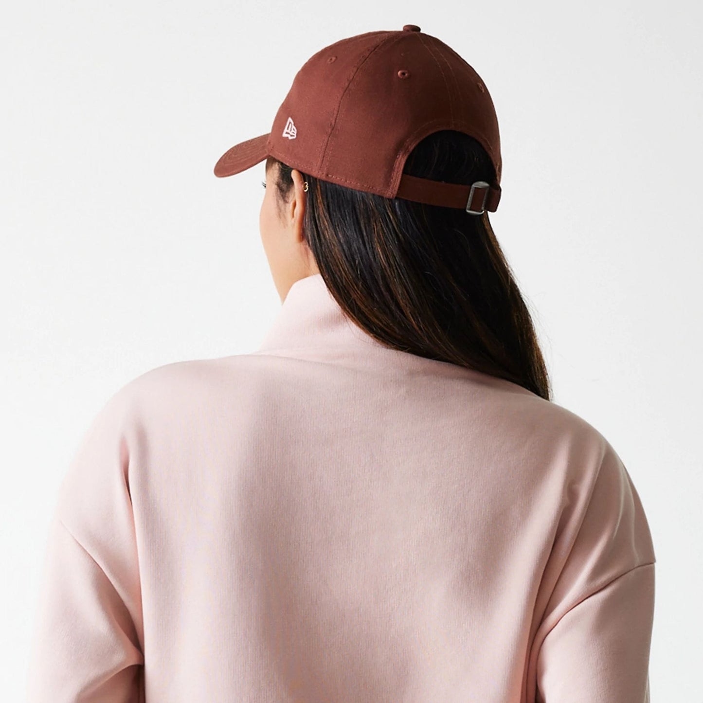 The Female model is wearing New York Yankees Womens MLB Tonal Pastel Pink Cropped 1/4 Zip Sweater 7