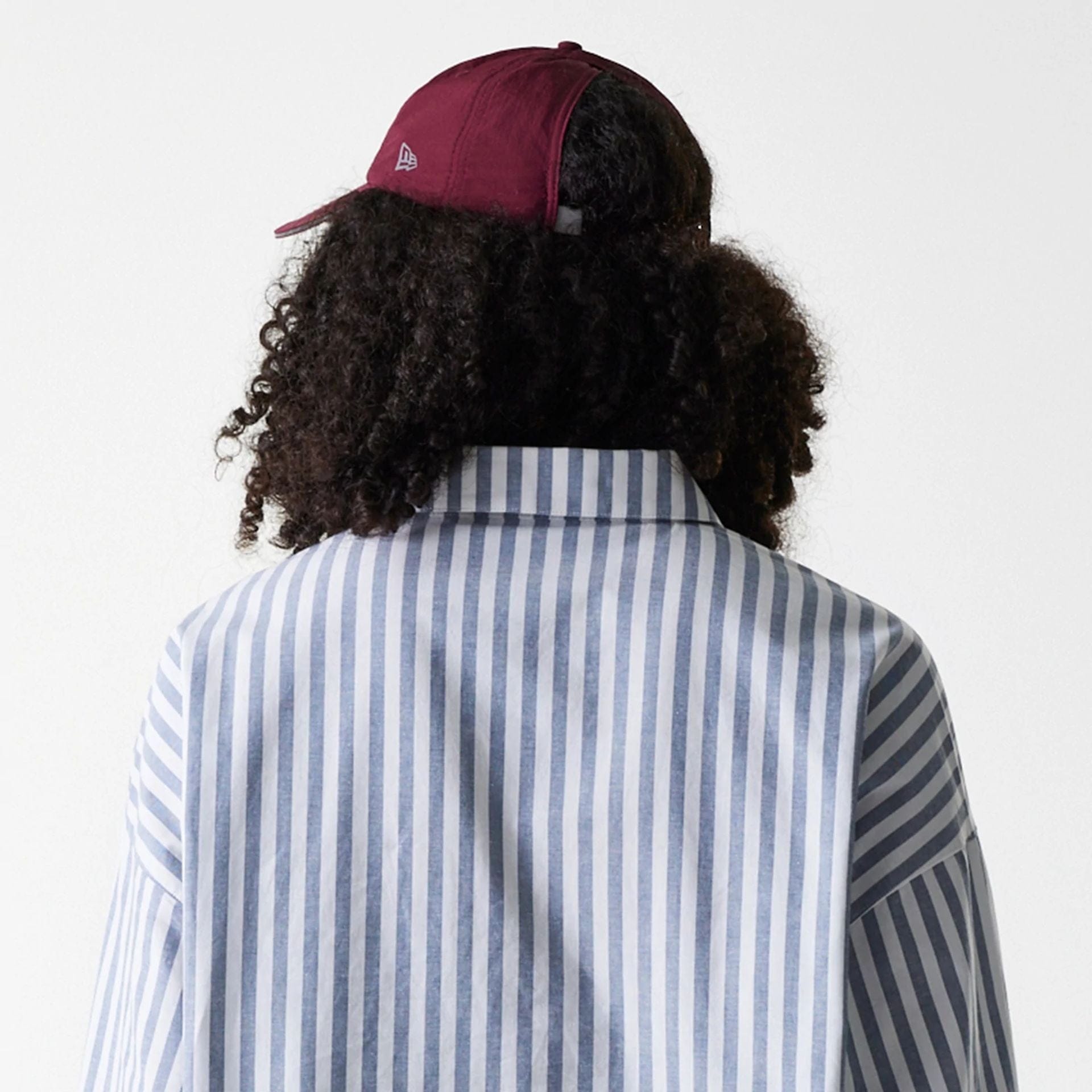 The Female model is wearing New York Yankees Womens MLB Stripe Dark Blue Long Sleeve Shirt 7