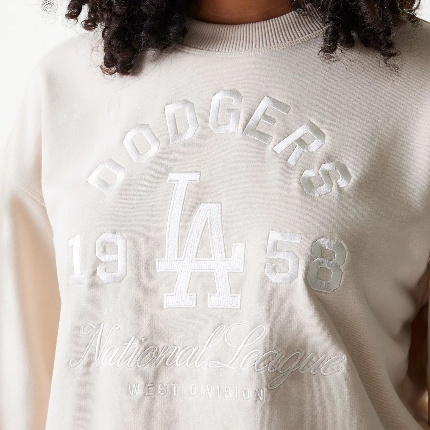 The Female model is wearing LA Dodgers Womens MLB Tonal Graphic Light Beige Oversized Crew Neck Sweater 4