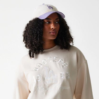 The Female model is wearing LA Dodgers Womens MLB Tonal Graphic Light Beige Oversized Crew Neck Sweater 6