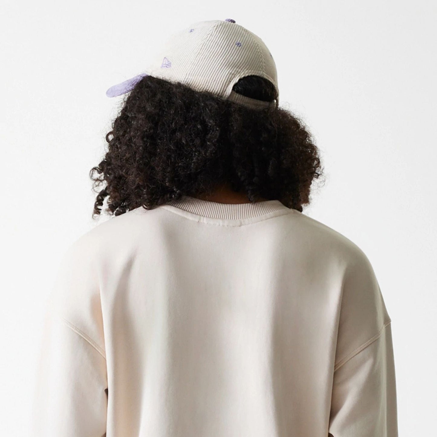 The Female model is wearing LA Dodgers Womens MLB Tonal Graphic Light Beige Oversized Crew Neck Sweater 7