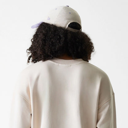 The Female model is wearing LA Dodgers Womens MLB Tonal Graphic Light Beige Oversized Crew Neck Sweater 7