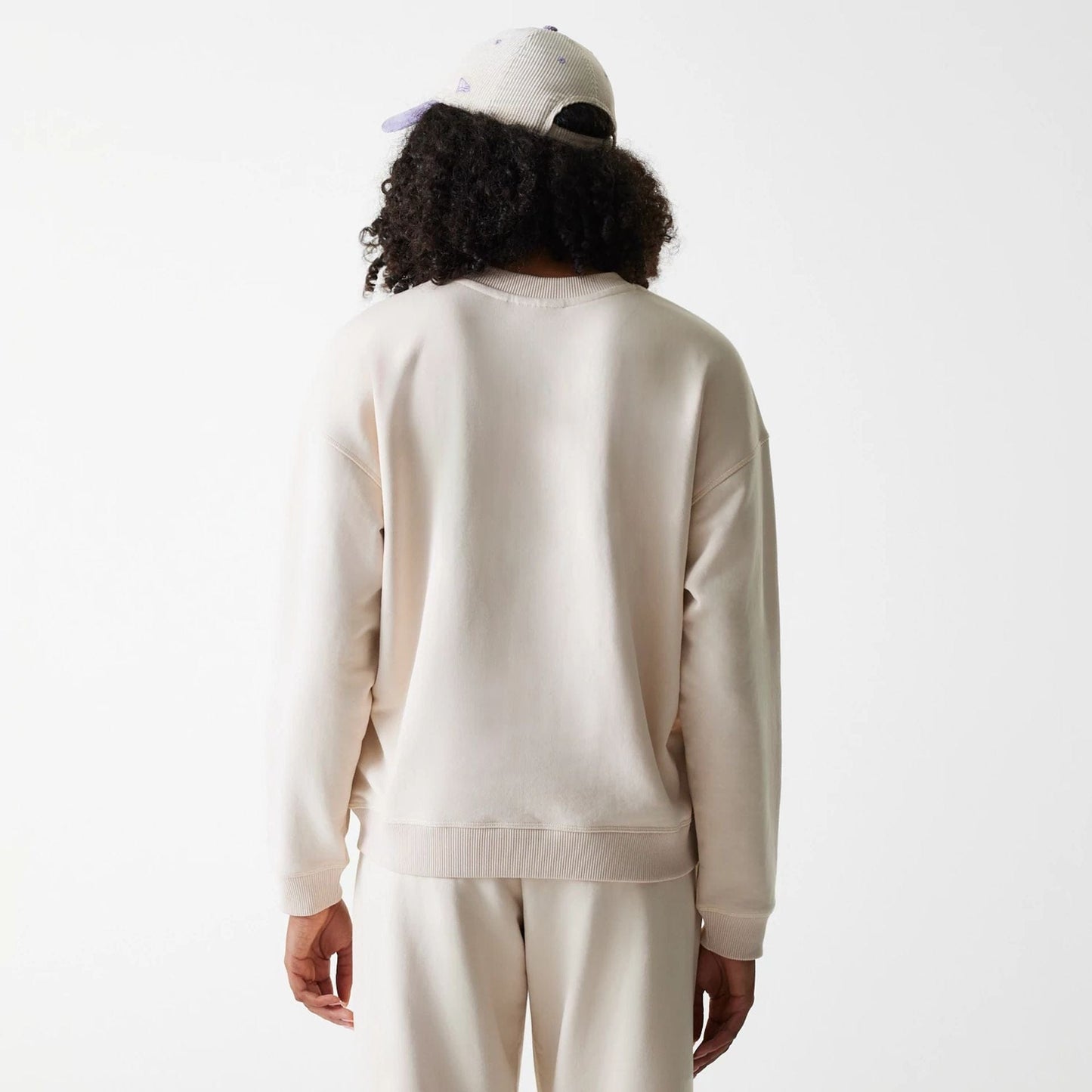 The Female model is wearing LA Dodgers Womens MLB Tonal Graphic Light Beige Oversized Crew Neck Sweater 2