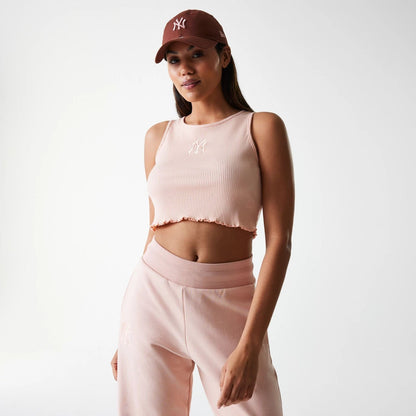 The Female model is wearing New York Yankees Womens MLB Rib Pastel Pink Rib Tank Top 1