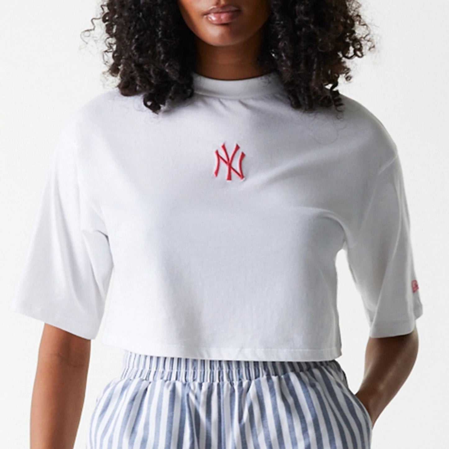 The Female model is wearing New York Yankees Womens MLB Stripe Dark Blue Shorts 6