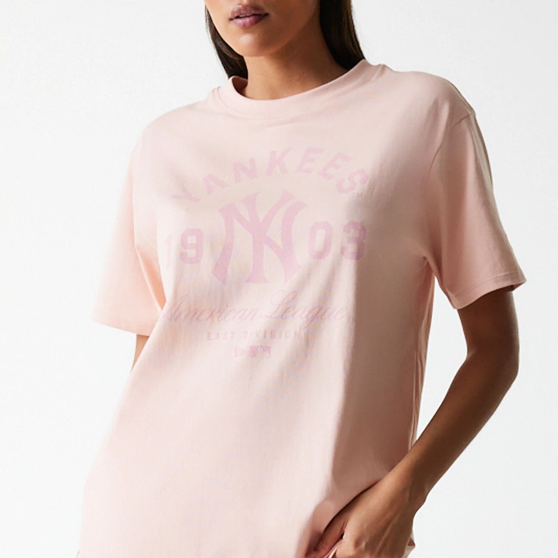 The Female model is wearing New York Yankees Womens MLB Tonal Graphic Pastel Pink Oversized T-Shirt 6