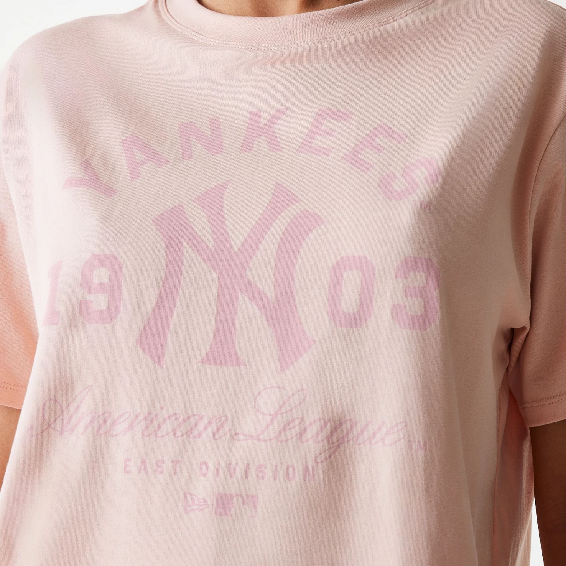 The Female model is wearing New York Yankees Womens MLB Tonal Graphic Pastel Pink Oversized T-Shirt 7