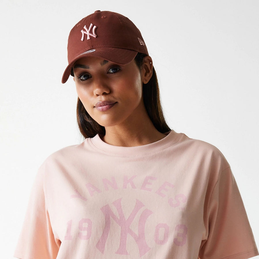 The Female model is wearing New York Yankees Womens MLB Tonal Graphic Pastel Pink Oversized T-Shirt 3