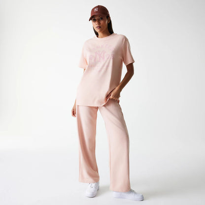 The Female model is wearing New York Yankees Womens MLB Tonal Graphic Pastel Pink Oversized T-Shirt 5
