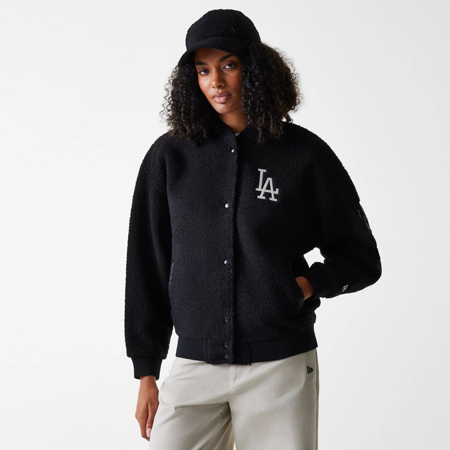 The Female model is wearing LA Dodgers Womens MLB Black Oversized Sherpa Bomber Jacket 1