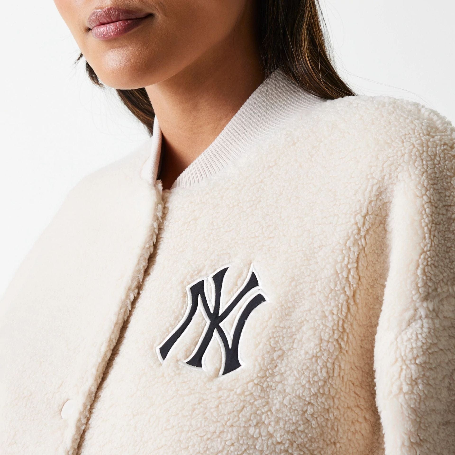 The Female model is wearing New York Yankees Womens MLB Light Beige Oversized Sherpa Bomber Jacket 5