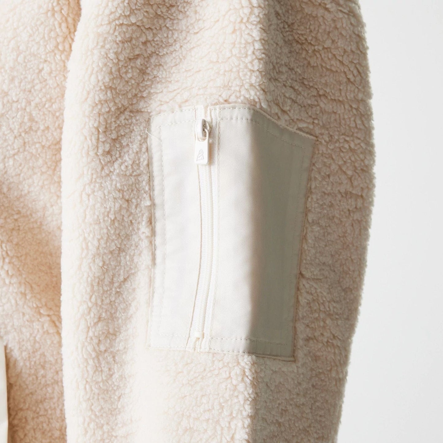 The Female model is wearing New York Yankees Womens MLB Light Beige Oversized Sherpa Bomber Jacket 4