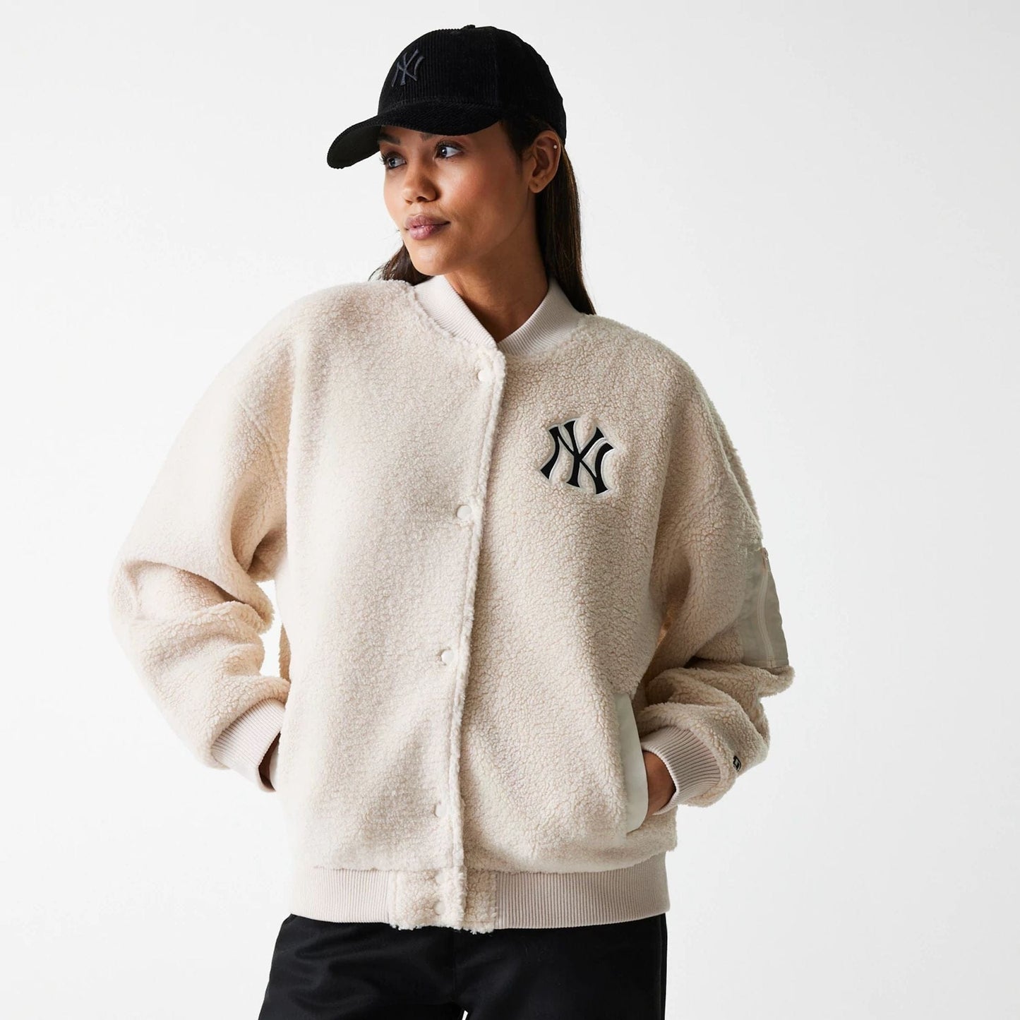 The Female model is wearing New York Yankees Womens MLB Light Beige Oversized Sherpa Bomber Jacket 1
