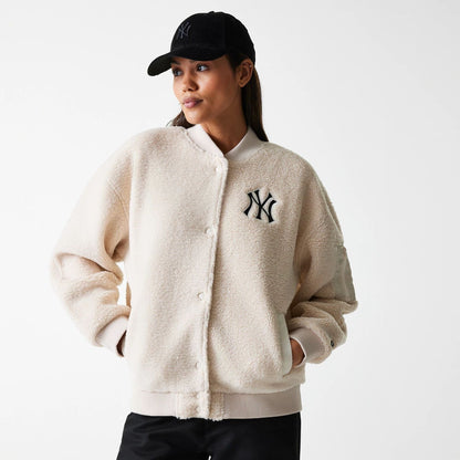 The Female model is wearing New York Yankees Womens MLB Light Beige Oversized Sherpa Bomber Jacket 1